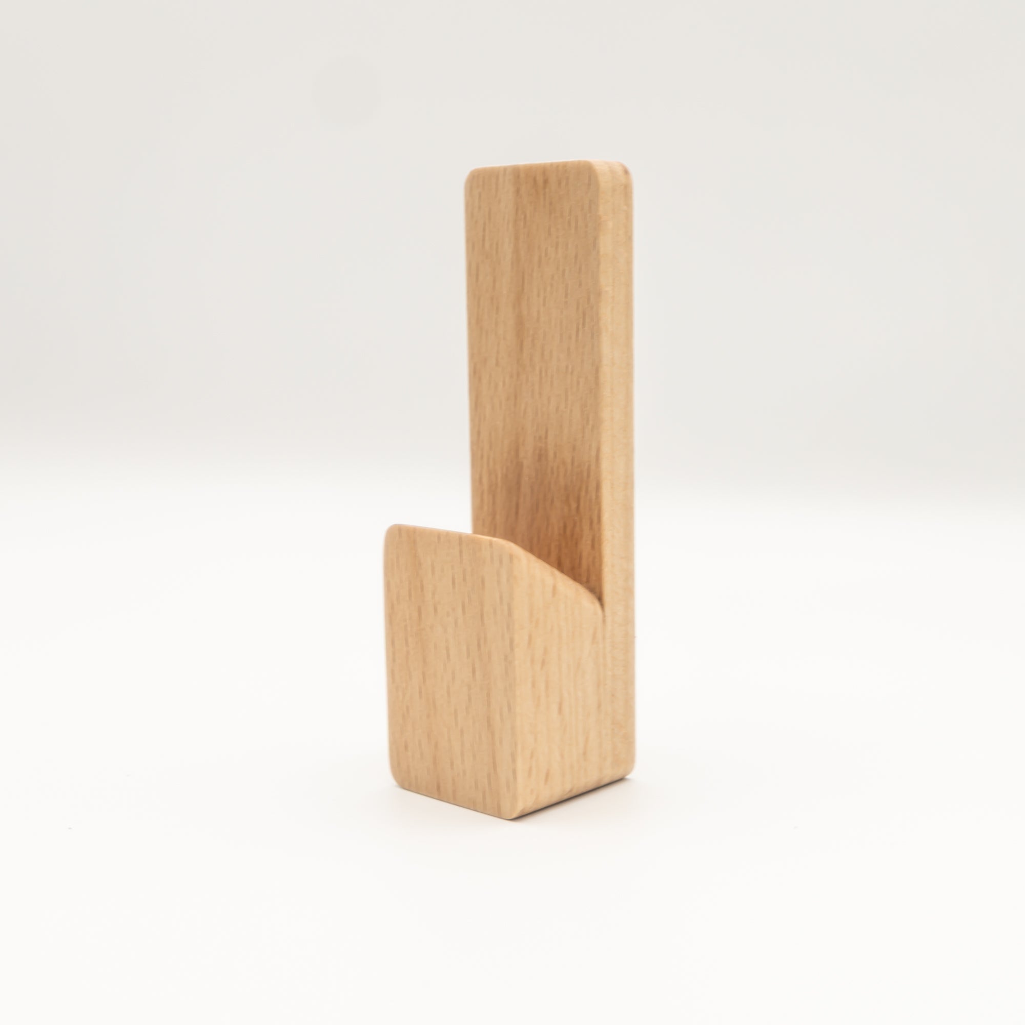 Solid beech hardwood self-adhesive wall hook mounted on bathroom wall