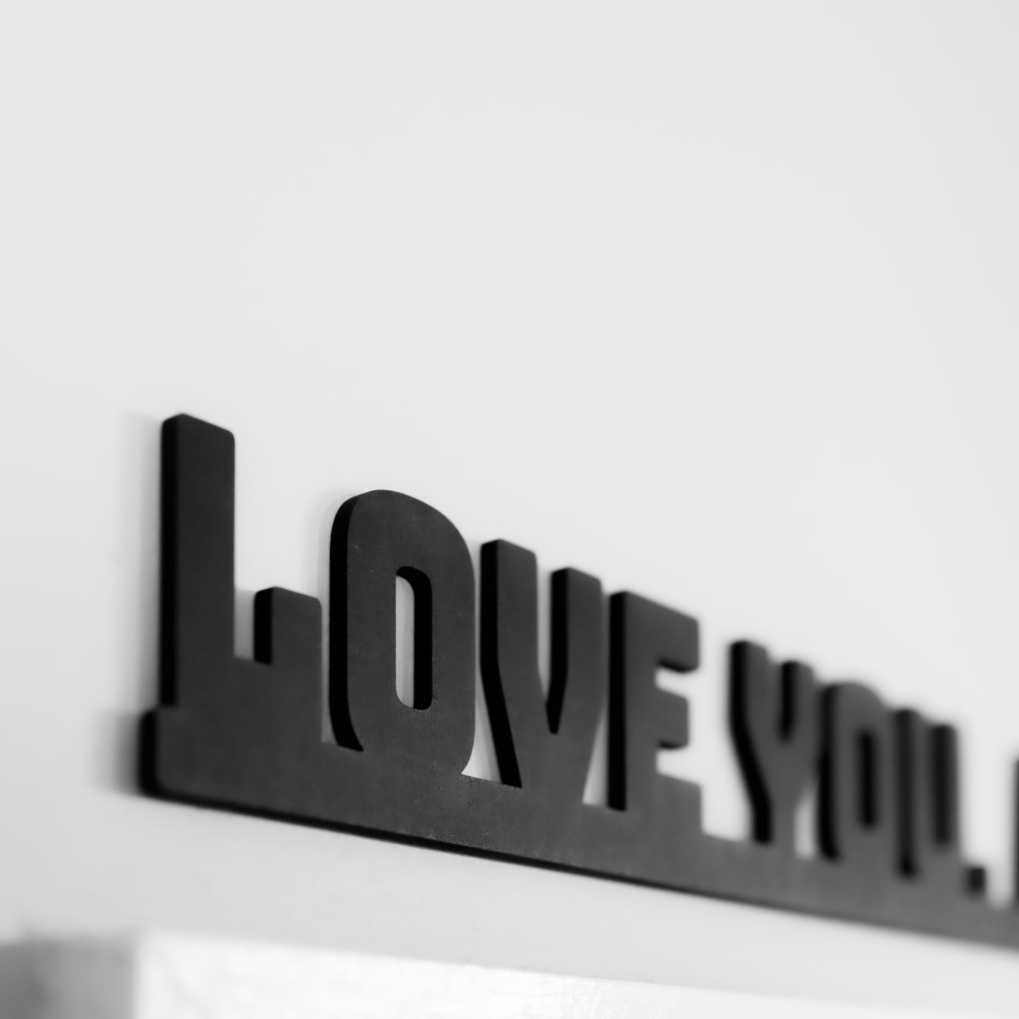 Black love you bye sign stuck to the door