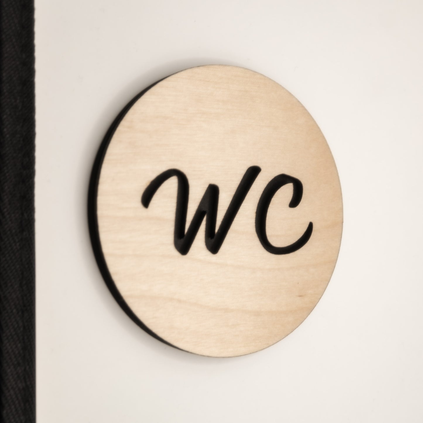 toilet door sign stuck on the wall