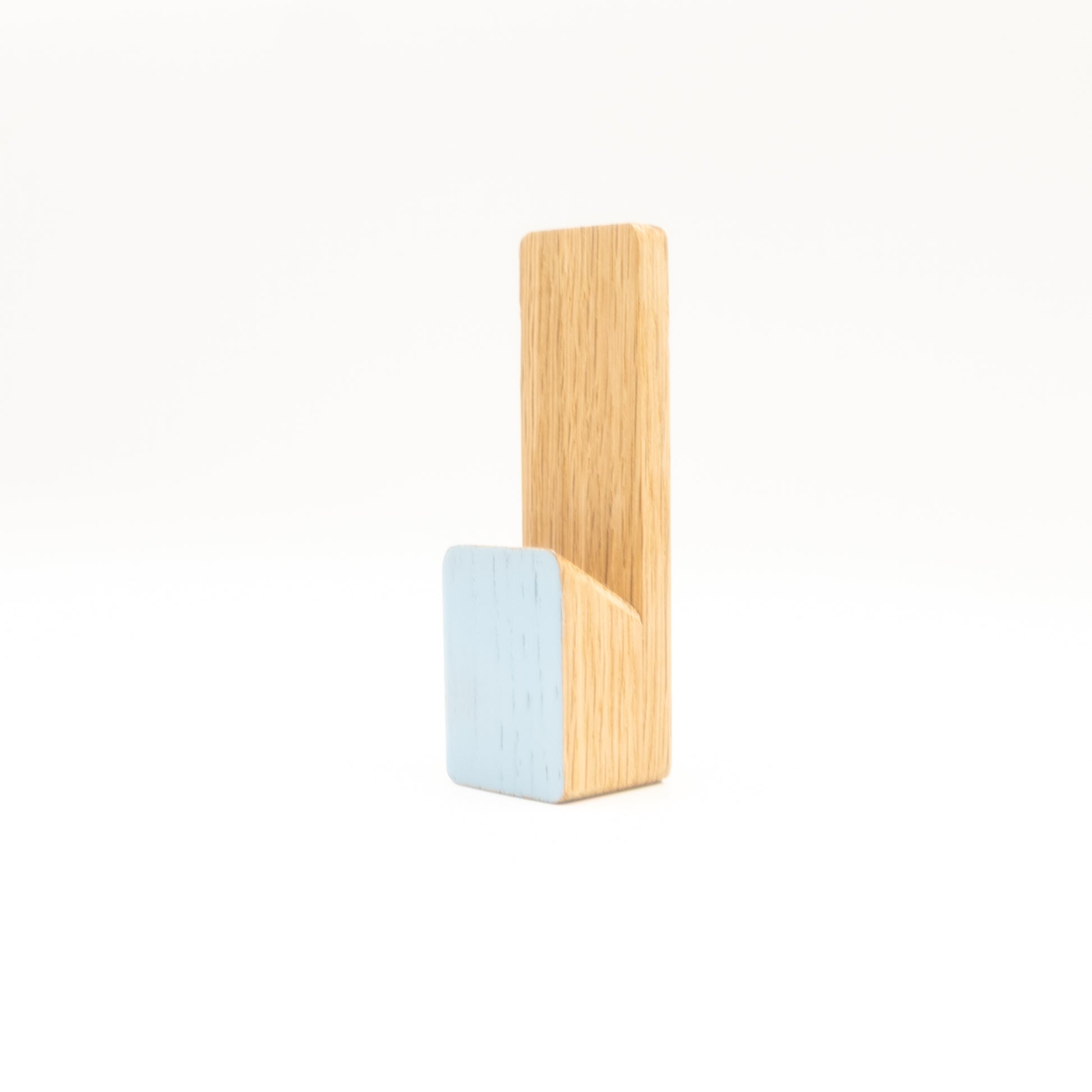 Wooden and light blue wall hook on a white background